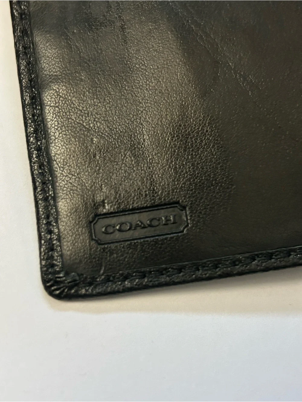 Coach Women’s Black Tri-Fold Wallet with Gold Script Logo